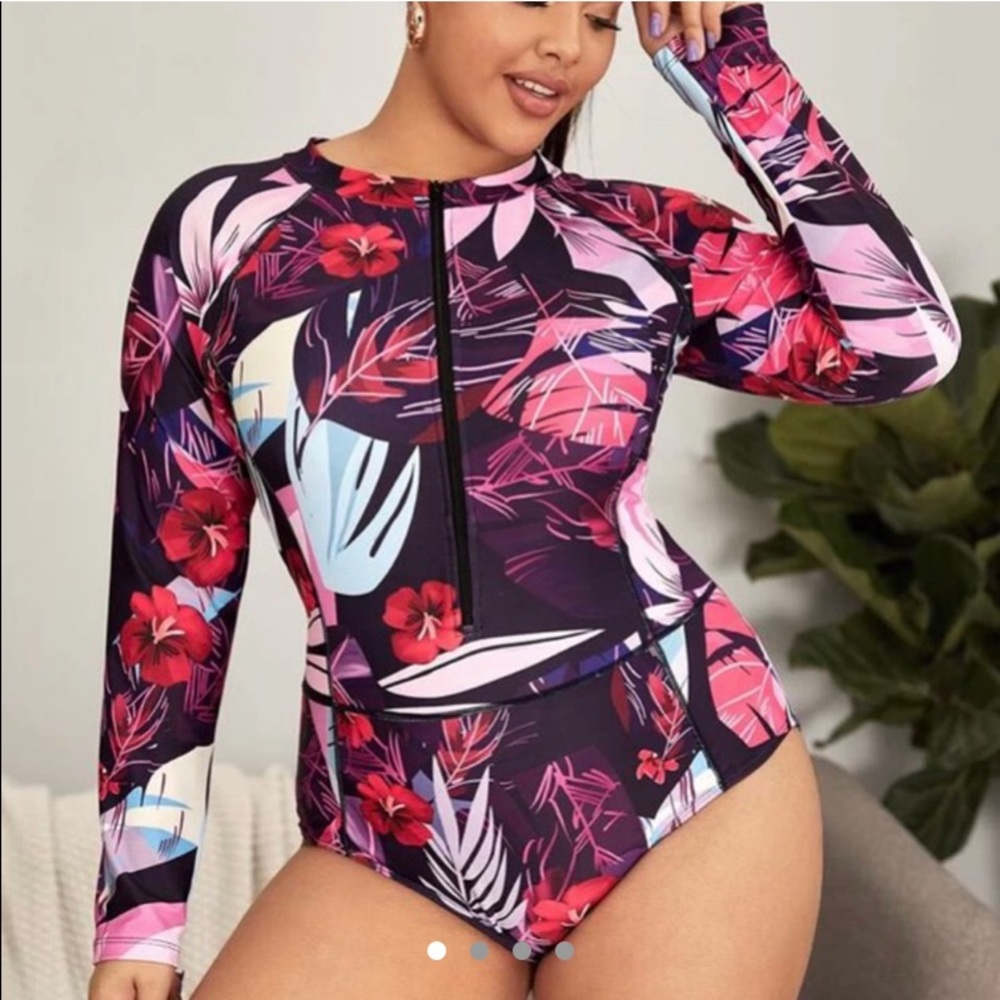Floral long sleeve one piece bathing suit.